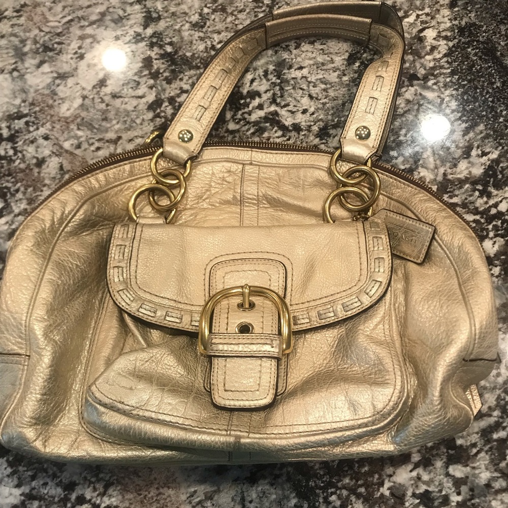 Gold metallic Coach bag.